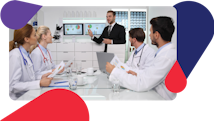 Health care professionals in conference room review data from medical equipment planning software on monitors