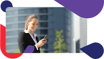 Young businesswoman smiling at a smart phone, native mobile capabilities, Accruent facilities management software
