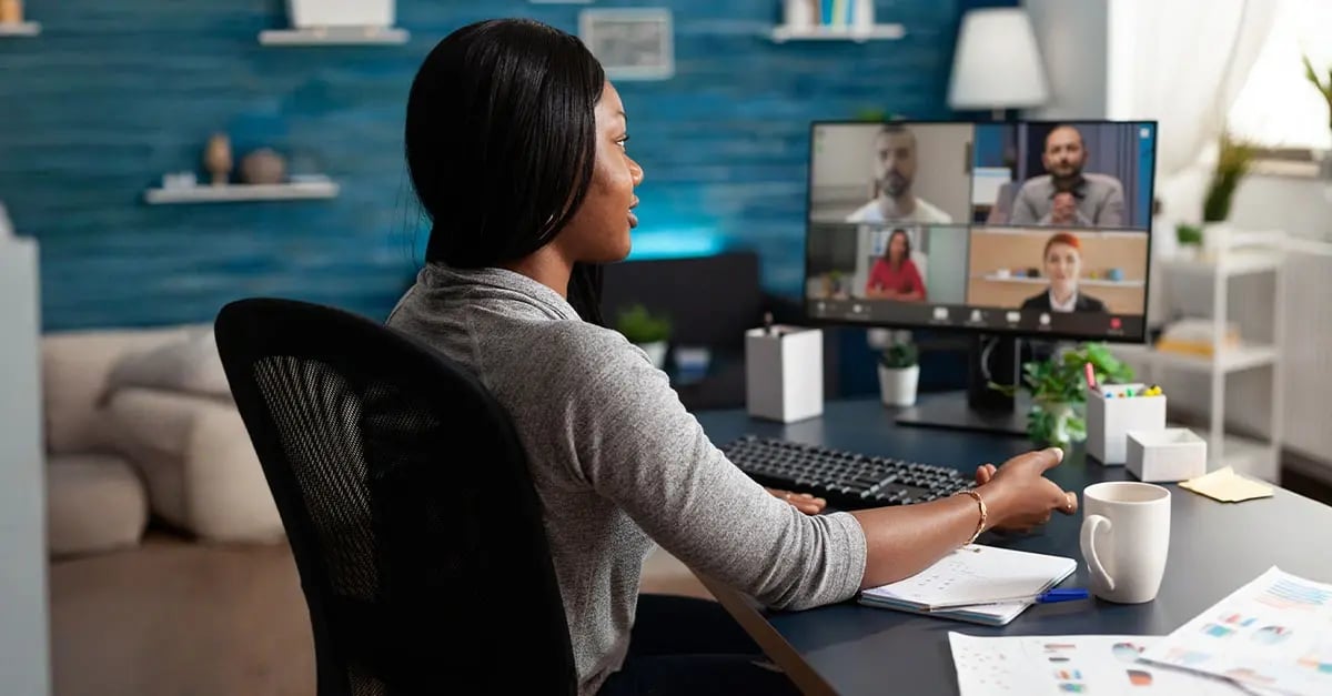 Remote employee participating in a virtual meeting as part of a hybrid work model