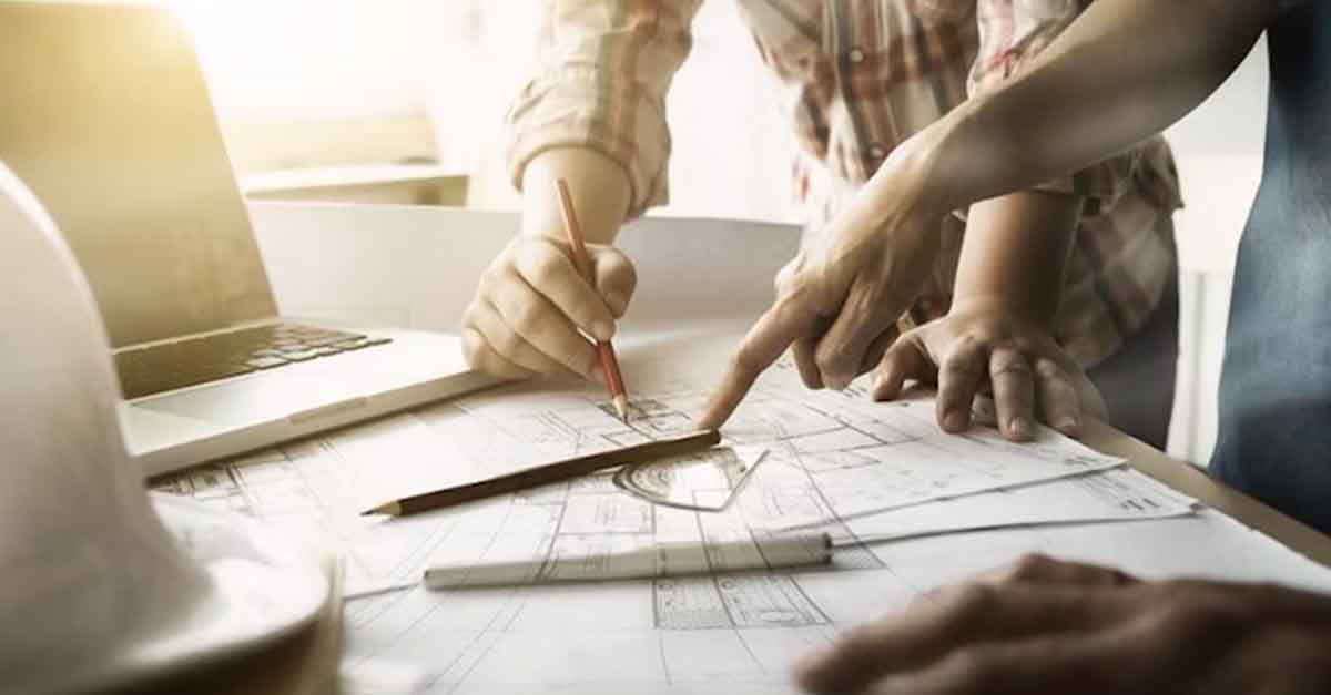 People reviewing architectural blueprints